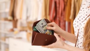 college financial planning, student holding wallet